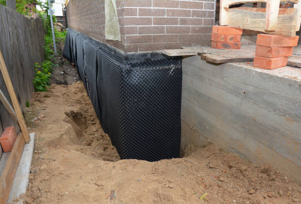 Happy homeowners after waterproofing job in Centerville